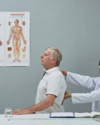 Female chiropractor examining a patient
