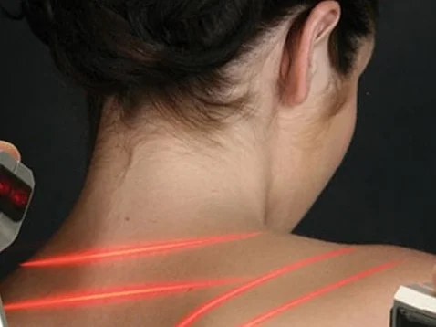 Denver laser therapy for pain used on woman's neck