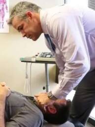 Denver Chiropractor James Doran adjusting cervical spine