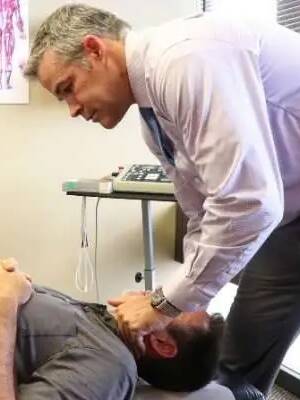 Denver Chiropractor James Doran adjusting cervical spine