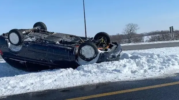 upside down car driving in snow